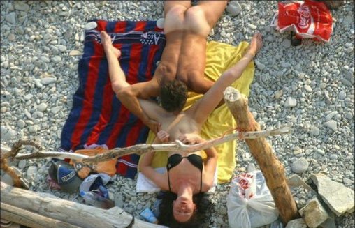 Husband Licks and Eats Wifes Pussy in Public Beach Photo pic